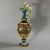 Minton Majolica ewer with a mythological theme which features putti, birds and vine fruits. The ewer has a tapered neck,...