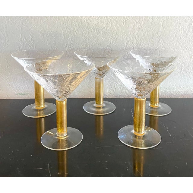 Vintage set of martini stemware by Union Street glass studio. The innovative design features blown crackle glass with gold...