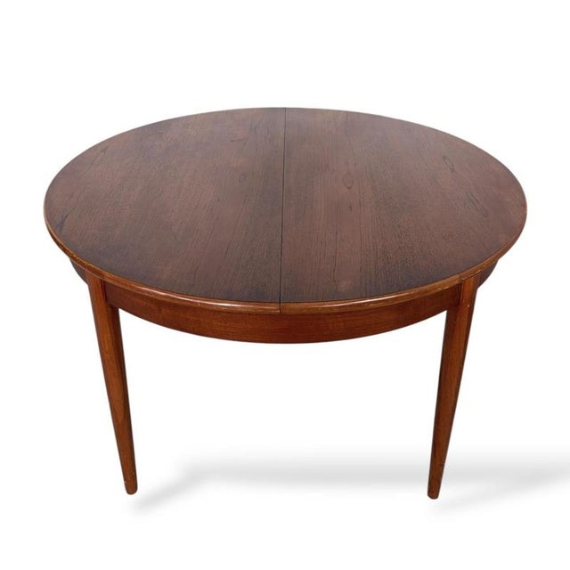 Wood Mid-Century Extending Teak Dining Table Round to Oval Butterfly Leaf Table from Elliotts of Newbury, 1960s For Sale - Image 7 of 11