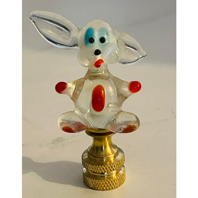 Blown art glass rabbit figurine as lamp finial on brass base.