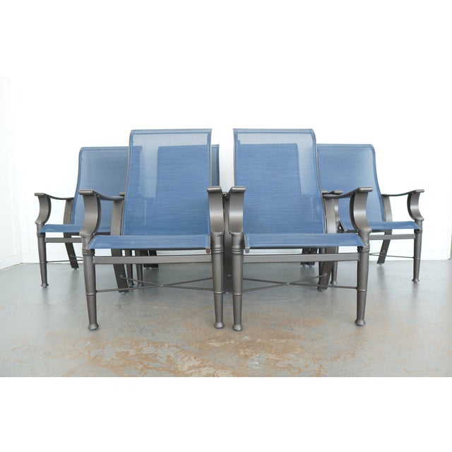 This Woodard patio dining set features a classic cast aluminum design with an elegant lattice-top table and coordinating...