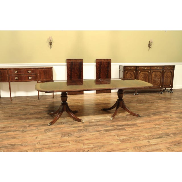 12-foot dining table with three leaves, capable of seating 12 to 14 people. The table expands to a full 12 feet with all...