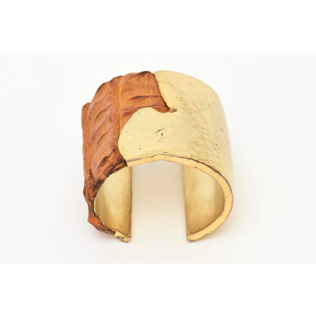 This chic signed hand hammered brass and stamped crocodile leather wide cuff bracelet is very artisan.From the 2000....