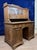 Art Nouveau period carved oak stepped desk circa 1900. Front opening with 6 doors, 2 of which are glazed with small panes,...