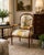 Elegant Louis XVI style fauteuil armchair featuring a carved walnut frame with fluted legs, scrolling arms, and...
