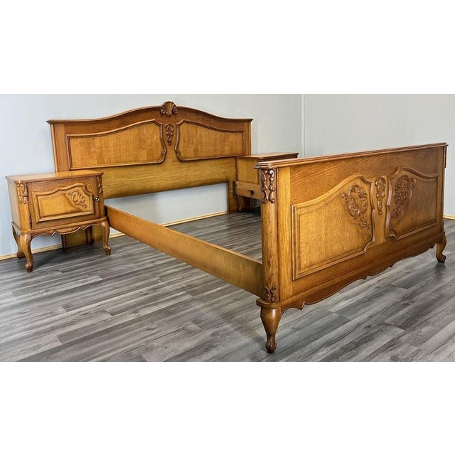 This elegant Vintage French Louis double bed frame with matching bedside tables offers classic carved detailing, warm...