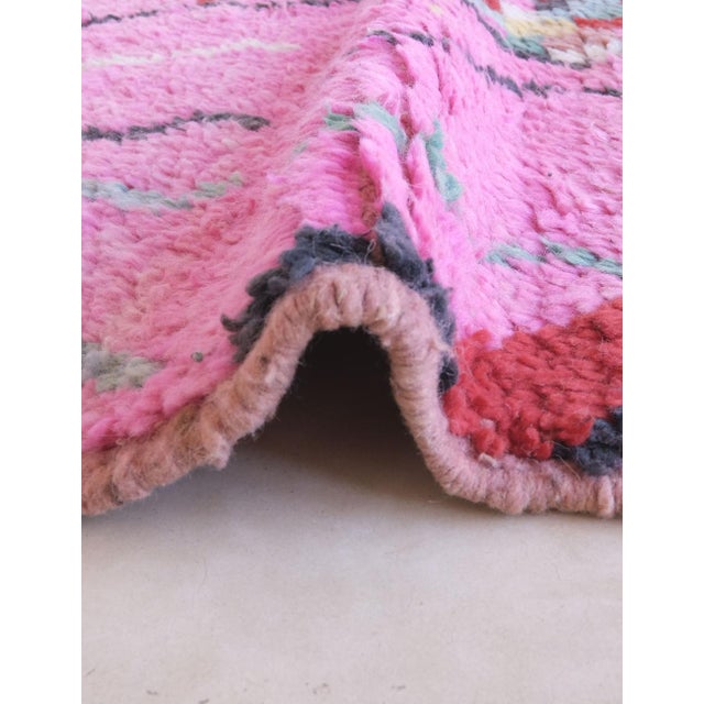 Bring color, culture, and artistry into your home with this Boujad Moroccan rug, a dazzling piece that captures the...