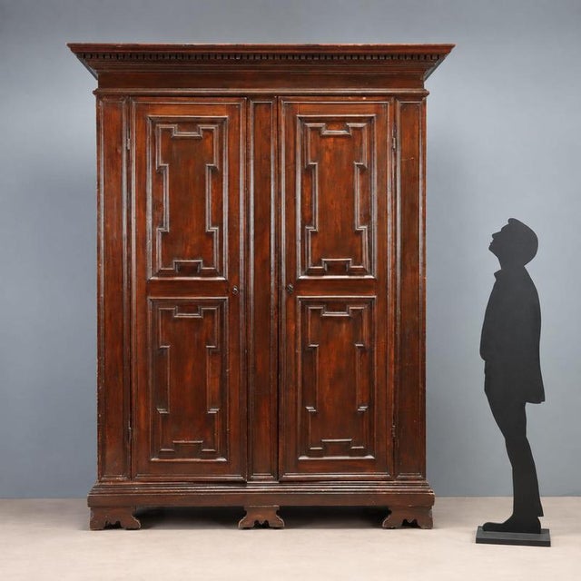 Baroque style wardrobe dating back to the late 19th century, made of walnut-stained beech. The structure features a front...