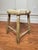 This is a simple, backless, round and low antique wooden stool. Often referred to as a "milking stool" or "farm stool". It...