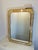 Unique original vintage mirror. It features brass outer edges followed by a thick marble frame and a second brass frame...