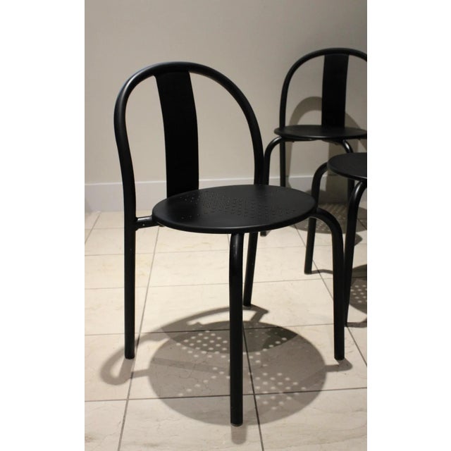 A rare set of four vintage IKEA Maxmo dining chairs manufactured in Italy during the 1980s. Featuring a minimalist tubular...