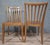 Pair of vintage chairs in light wood, with a simple and elegant design, dating from the 1950s-1960s. They feature a gently...