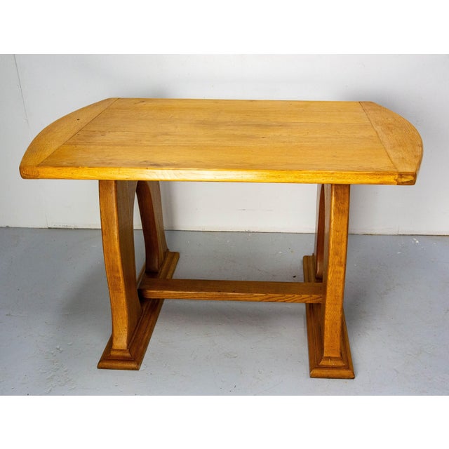 Oak table made circa 1960. The table shape is inspired by the lines of art nouveau. This gives to this item an elegant and...
