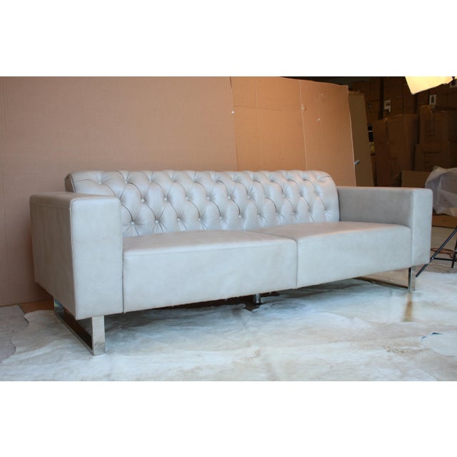 leather Mid-Century modern sofa will warm up any living space. It's accentuated with sleek metal legs to add a touch of...