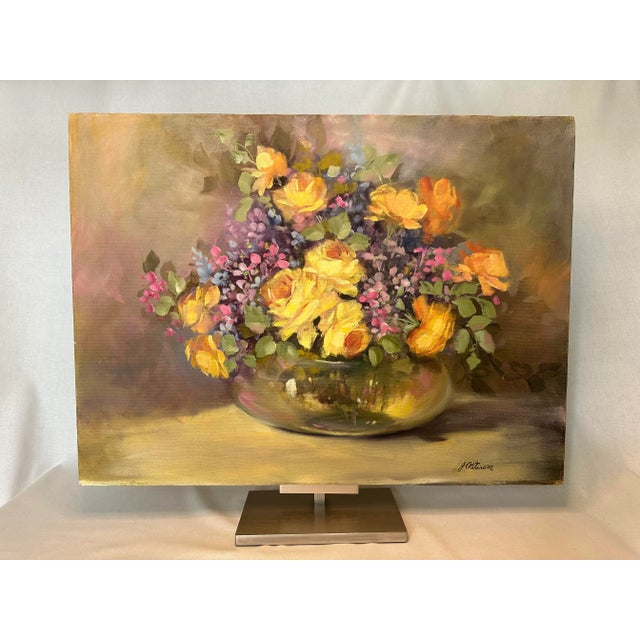 The blend of colors amongst the butter yellow roses and small, but varied blue and pink flowers make this an exquisite...