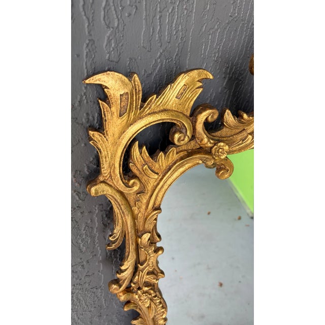 This is an incredibly beautiful gilt mirror. It is labelled on the back Freidman Brothers. It is French Baroque and...