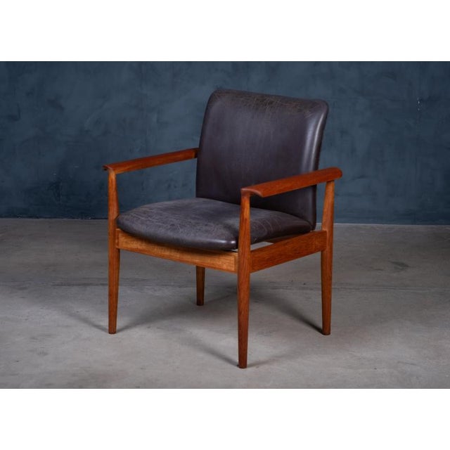 Diplomat armchair model FD 901 designed by Finn Juhl and produced by France & Son, Denmark, in 1961. The chair features a...