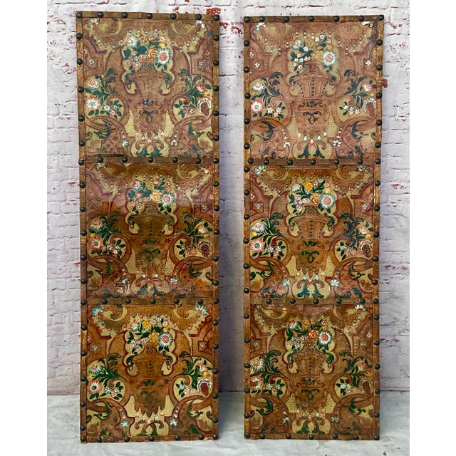 Large Pair of 18th Century Italian Painted and Tooled Leather Panels. Each rectangular panel features a symmetrical...