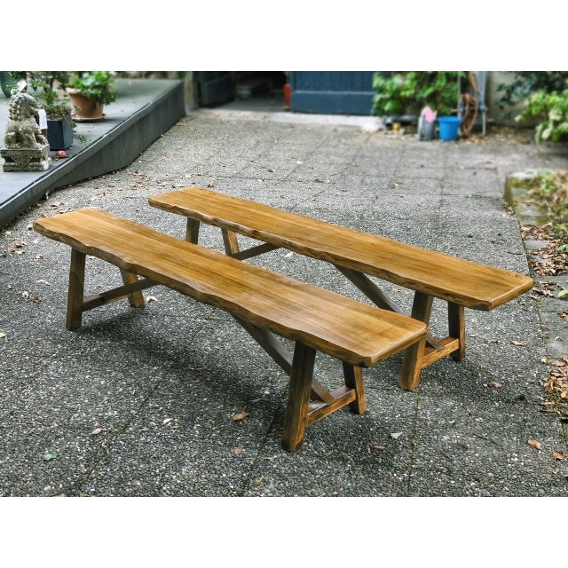 Pair of large benches in solid light elm, manufactured by the Aranjou company in France in the 1960s/70s. The elm boasts a...