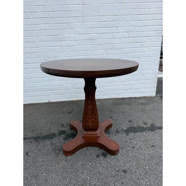 Charles X French-style marquetry inlaid pedestal center side table, It features in marquetry on rosewood veneer, mother of...