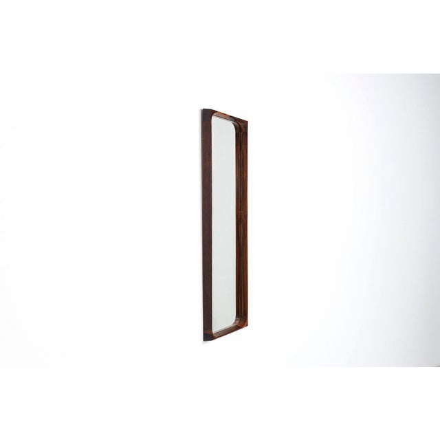 Niels clausen wall mirror in rosewood for nc møbler, denmark, 1960s. A refined example of danish modern design,...