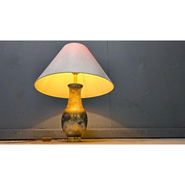 Vintage pewter table lamp with brass chinese influenced decors troughout. Original lamp shade provided. Tested and ready...