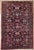 Antique hand-knotted rug from the Nanaj region of western Iran, featuring an allover floral design set on a deep navy...