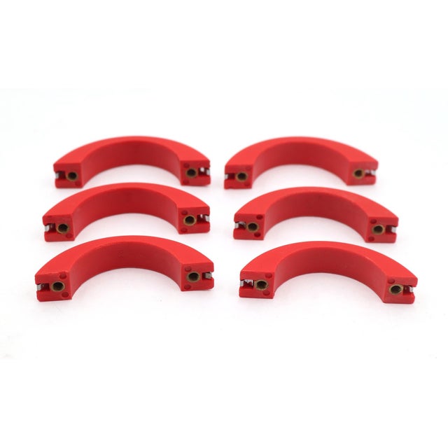 Vintage Art Deco style drawer or cabinet pulls made of red plastic with a chrome plated brass strip. Mounting screws are...