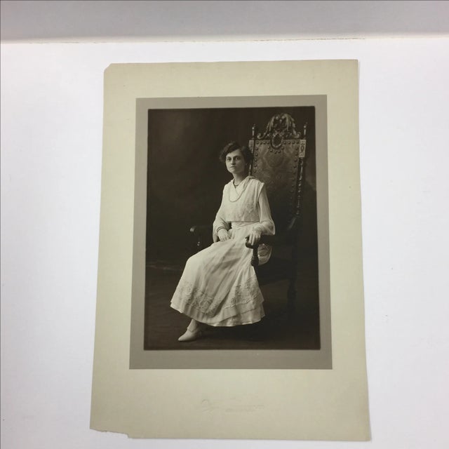 Regal original portrait of a woman in a decorated throne like chair. Jersey City, NJ studio. On tinted paper. Chips in top...