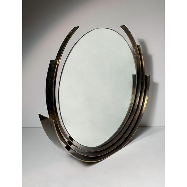 Curtis Jere brass circular round mirror. Style of Paul Evans Slight bend at bottom area. I believe a metal shop should be...