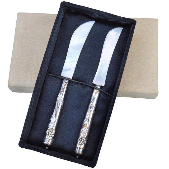 Gorgeous set of 2 antique handcrafted mother-of-pearl and Sterling silver caviar knives in original box. Exhibiting an...