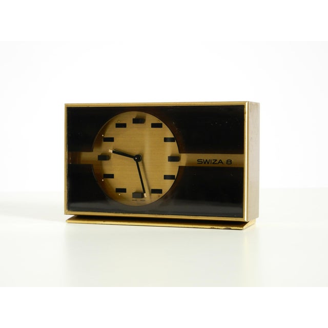 A beautiful, rare, and authentic small SWIZA 8 mechanical brass table clock. Features a fantastic minimalist design....