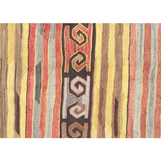 Bring a unique and traditional style to your home with this handcrafted Vintage Turkish Kilim. Boasting a classic wool-on-...