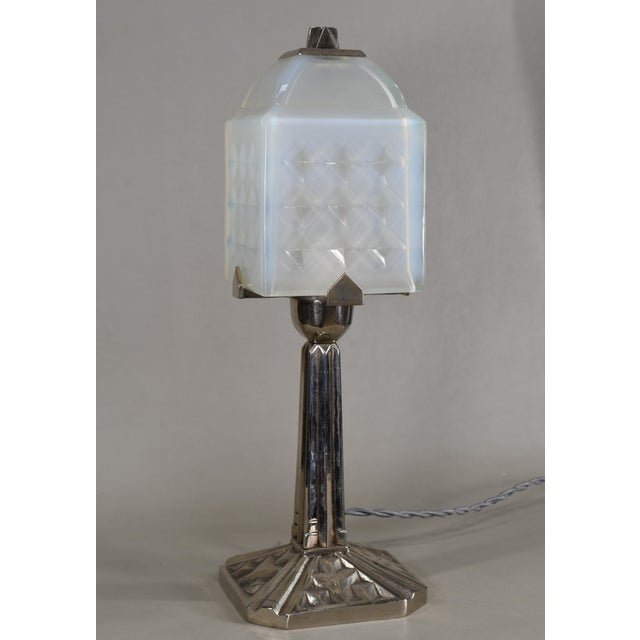 Simonet frères & Dieupart A beautiful French 1925-1930 art deco lamp in nickel plated solid brass or bronze holding a...