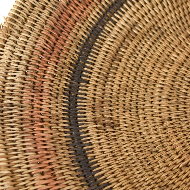 Handwoven Makenge flat wedding basket handmade by the Mbundu women within Zambia. These baskets are traditionally made...