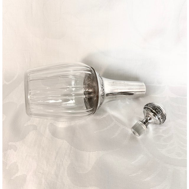 Antique French Baccarat cut-crystal and sterling silver liquor decanter by the renowned Parisian silversmiths Ravinet...