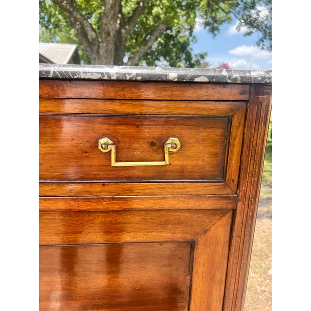 Elegant 19th-century Louis XVI style secretary desk, crafted in richly figured wood with a warm, polished finish....