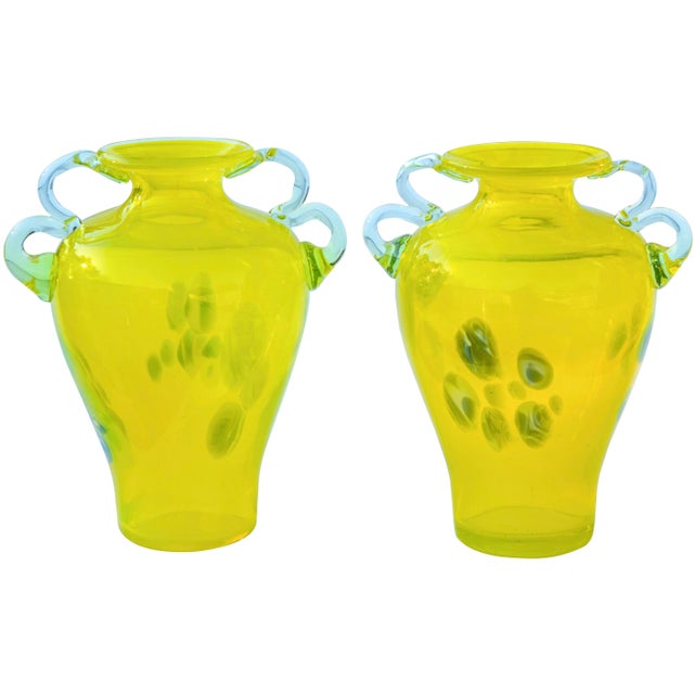 Gorgeous set of two midcentury hand-blown Murano style Italian art glass vases with handles. Featuring a remarkable...