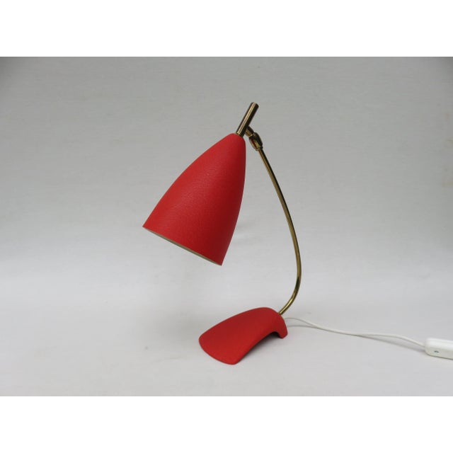 Table lamp from the 50s, in the combination shrink varnish red and brass from the company gebr. Cosack, neheim-hüsten. a...