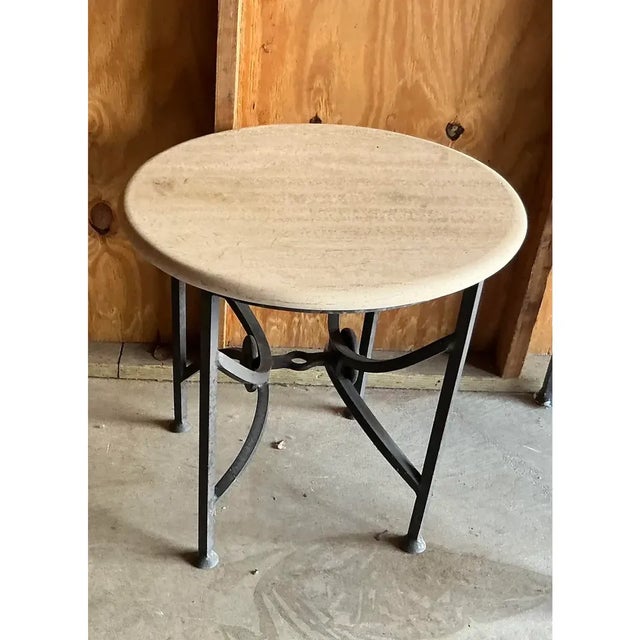 Kreiss Mykonos Patio end table. Aluminum base, travertine top. Good condition Dimensions 28ʺW × 28ʺD × 28ʺH