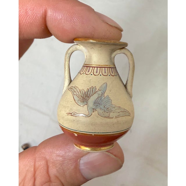 Up for sale is an exquisite antique hand-painted miniature Greek amphora dollhouse pottery vase. It is a handmade,...