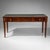 Elegant Empire writing desk (Bureau Plat) in mahogany. The desk stands on tapered, smooth legs with ball feet and brass...