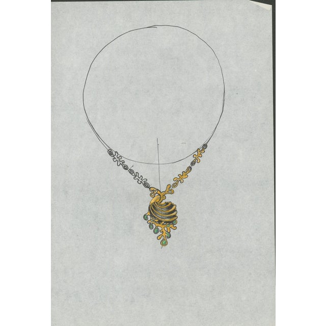 Original jewelry design drawing of an ornate pendant necklace with a ribbed gold-tone central form and small green jewel-...