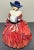 Up for sale is a 1943 English Royal Doulton Porcelain Genevieve Figurine (HN 1962) (Retired)! It measures 7 1/8” tall. The...
