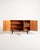 Teak cabinet with three hinged doors, black-stained details, shelves, and removable trays. "Casino" model, Sweden, 1950s....