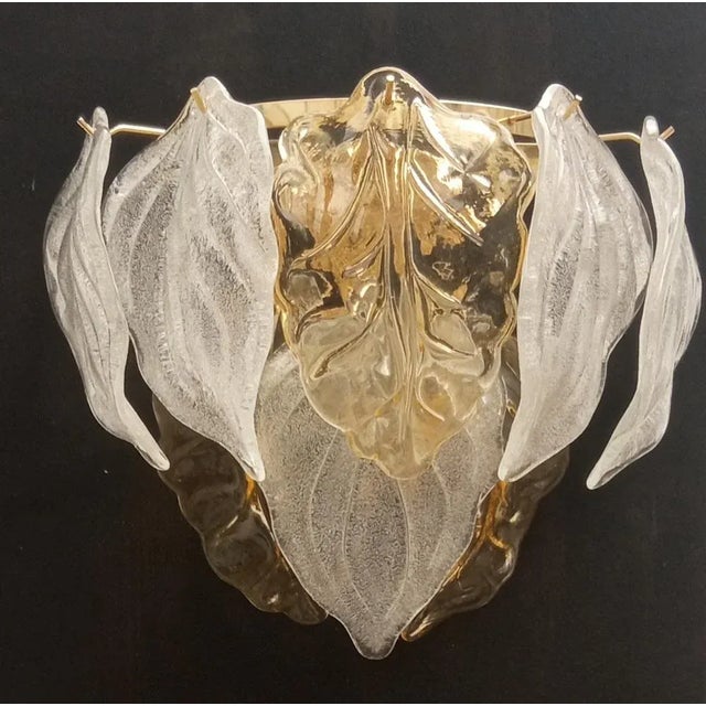 Murano glass appliques worked in two -colored plate with transparent finish and dew grit. Two E14 lamp holders suitable...