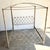 An elegant vintage Hollywood Regency canopy bed crafted in sculptural iron with a warm antiqued finish. The tall posts...
