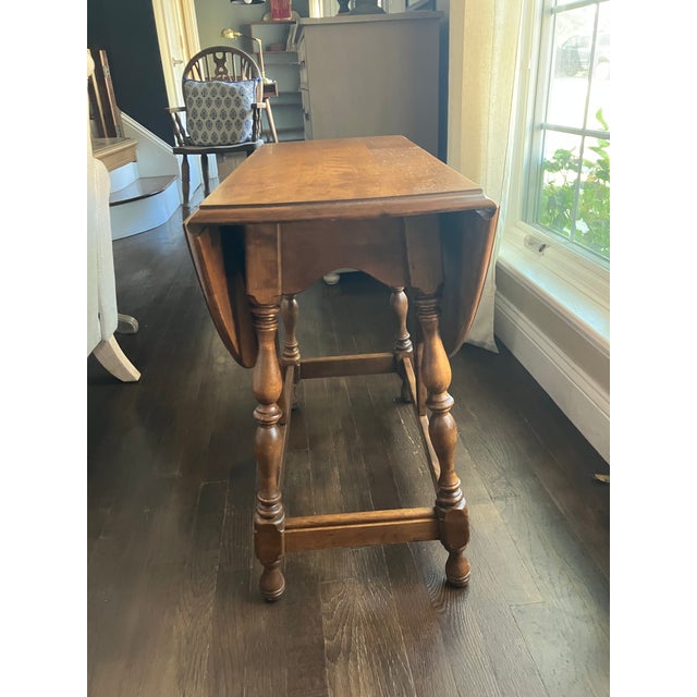 Vintage Ethan Allen drop leaf table. Original condition minor imperfections; shown in photos. Good overall condition....