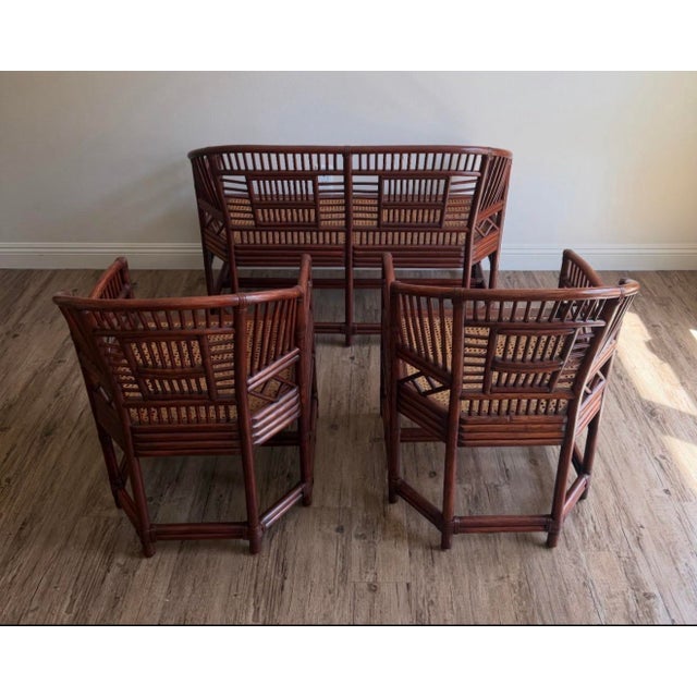 A striking vintage three-piece Brighton Pavilion–style seating set consisting of one settee and two matching armchairs....
