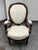 Design Plus Gallery presents a Victorian Rococo Revival carved wood balloon back armchair. The chair has an ornate carved...